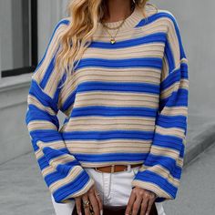 Look beautiful and comfy in the Electra Knitted Sweater! This stripey number is crafted from jersey fabric with a loose fit, long top length, and crew neck, so you can be sure to look stylish and keep cozy at the same time. The long sleeves are made from acrylic so you don't have to worry about cold nights! Get your stripes on and stay warm in Electra! Specs: Material: Acrylic Oversized Textured Knit Crew Neck Top, Oversized Textured Knit Top With Crew Neck, Oversized Knit Top With Ribbed Cuffs And Crew Neck, Oversized Crew Neck Knit Top With Ribbed Cuffs, Oversized Striped Soft Knit Top, Oversized Comfortable Knit Sweater, Oversized Crew Neck Knit Top, Comfortable Blue Sweater For Fall, Casual Striped Knit Top For Fall