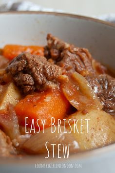 a close up of a bowl of food with meat and carrots in it that says easy brisket stew