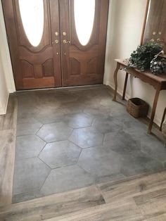 home entryway tile design Tiles Mixed With Wood Floor, Tile Entrance To Wood, Tile Kitchen To Wood Living Room, Breezeway Tile Floor, Foyer Tile Ideas Entryway Hexagon, Tiled House Flooring, Farmhouse Foyer Tile Floor, Tile With Hardwood Floors, Wood Tile Floor Whole House