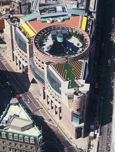 an aerial view of a large building in the city