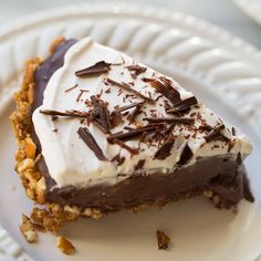 a piece of chocolate puddinging pie on a white plate with the words gluten - free, vegan chocolate puddinging pretzel pie