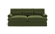 a green couch sitting on top of a white floor