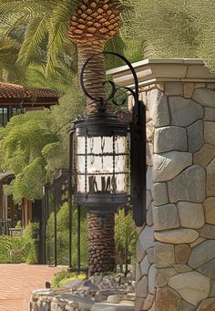 a lamp post with a palm tree in the background