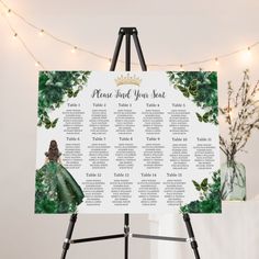 a wedding seating chart is displayed on a easel