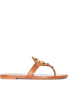 Miller flat thong sandals from TORY BURCH featuring brown, leather, thong strap, bronze-tone logo plaque, branded insole, slip-on style and flat leather sole. Sandals Brown, Tory Burch Miller, Brown Sandals, Tory Burch Shoes, Thong Sandals, Tory Burch, Brown Leather, Shoes Sandals, Fashion Branding