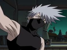 an anime character with white hair and black clothes holding his arm up in the air