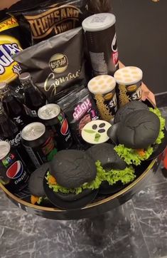 a basket filled with food and drinks on top of a table