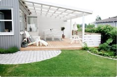 a patio with a table and chairs on it