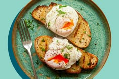 two pieces of toast topped with poached eggs