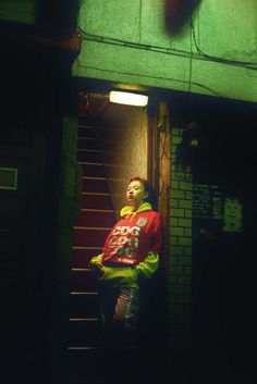 a man standing in the doorway of a building