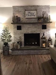 a living room filled with furniture and a fire place in the middle of a wall