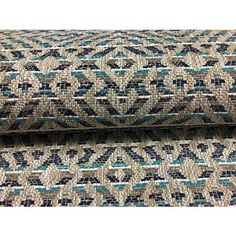 two pieces of fabric with blue and beige designs