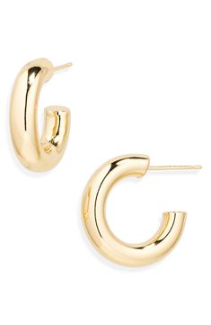 Complete any outfit with these lightweight puffed tube huggie hoop earrings boasting a high-shine finish. 21mm hoop diameter; 5mm width Post back Goldtone plate or silvertone plate Imported Good Earrings, Preppy Jewelry, 2024 Christmas, Kids Uggs, Earrings In Gold, Fall Accessories, How To Make Shoes, Huggie Hoop Earrings, Keep Jewelry