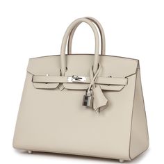 This Birkin is in Craie epsom leather with palladium hardware and has tonal stitching, front flap, two straps with center toggle closure, clochette with lock and two keys, and double rolled handles.The interior is lined with Craie chevre and has one zip pocket with an Hermes engraved zipper pull and an open pocket on the opposite side.Collection: WOrigin: FranceCondition: New and never worn (Plastic on hardware)Accompanied by: Hermes box, Hermes dustbag, clochette, lock, two keys, clochette dustbag, felt, carebookMeasurements: 10" width x 7.5" height x 4.75" depth; 2.75" handle drop Classic Cream Bag With Turn-lock Closure, Cream Calf Leather Bags With Palladium Hardware, Timeless Calf Leather Bag With Hasp Closure, Formal Cream Bag With Turn-lock Closure, Timeless Cream Bags With Turn-lock Closure, Timeless Cream Bag With Turn-lock Closure, Formal Calf Leather Bag With Lock, White Epsom Leather Bag With Palladium Hardware, Elegant White Bag With Lock