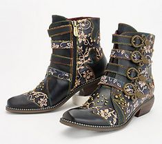 Western-style inspiration meets a Victorian vibe in these Rodeha ankle boots. Embossed floral details and bow-shaped, antiqued hardware marry with burnished leather sprinkled with studded accents to create an eclectic energy that instantly adds pizzazz to whatever you're wearing. From L'Artiste by Spring Step. L'artiste By Spring Step, Unique Clothes, Shoe Ideas, Hot Boots, Buckle Ankle Boots, Swaggy Outfits, Artist Style, Fantasy Fashion, Unique Outfits