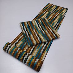 This multicolor African Fabric is high quality African print made from 100% cotton and it's 45 inches wide. It is used for making African Clothing, African quilts, & For Home decoration. FYI: Print is Double sided. The listing is for 1, 6 yards and Headwrap Each piece of fabric measures:  36in by 45in for 1 yard 216in by 45in for 6 yards 70in by 22in for Head wrap If you purchase more than one yard, you will receive one continuous piece. *If you require more than what I have listed, feel free to send me email. CARE INSTRUCTIONS: *DO NOT BLEACH *Hand wash with cold water and mild soap or Dry clean *Press with hot iron for a crispy look. Color may be different due to your monitor Brown Ankara Fabric With Batik Print, Multicolor Batik Print Fabric And Notions, Traditional Brown Ankara Fabric, Multicolor Batik Print Fabric Patterns, Multicolor Ankara Fabric With Abstract Pattern, African Quilts, Clean And Press, African Textile, African Prints