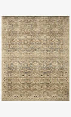 an area rug with many different colors and patterns on the carpet, including beiges and browns