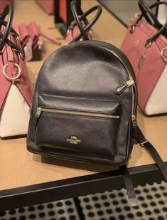 NWT Coach Leather Charlie Backpack In Black. 100% Authentic Refined pebble leather Inside zip pocket Zip closure, fabric lining Top handle with 2" drop Outside zip pocket Adjustable shoulder straps Size: 10 3/4" (L) x 12 1/2" (H) x 4" (W) Shipping same day Coach Leather Backpack With Zipper Pocket, Classic Crossbody Backpack, Classic Coach Leather Backpack With Zipper, Classic Coach Leather Backpack With Zipper Closure, Coach Leather Backpack With Zipper Closure, Coach Luxury Leather Backpack With Zipper Closure, Coach Luxury Leather Backpack With Zipper, Coach Black Leather Backpack For Everyday Use, Luxury Coach Leather Backpack With Zipper Closure