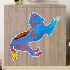 a wooden cabinet with an image of a person on it