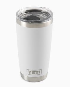 the yeti cup is white and has a silver lid