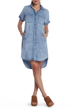 This lightweight denim shirtdress is designed in a classic straight silhouette with short sleeves and a rounded high-low hem. Front button closure Spread collar Short sleeves Chest patch pockets; side-seam pockets 50% cotton, 50% lyocell Machine wash, tumble dry Imported Casual Button-up Shirt Dress With Rolled Sleeves, Trendy Short Sleeve Summer Shirt Dress, Trendy Cotton Knee-length Shirt Dress, Casual Button-up Dress With Rolled Sleeves, Trendy Short Sleeve Shirt Dress For Day Out, Medium Wash Short Sleeve Denim Dress, Relaxed Fit Denim Blue Shirt Dress With Pockets, Casual Knee-length Shirt Dress, Chambray Short Sleeve Dress With Pockets