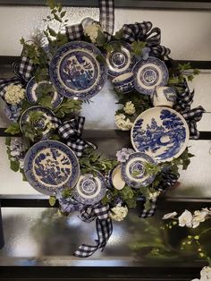 a wreath with blue and white plates on it