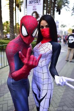 two people dressed up as spider man and woman