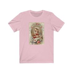 Beautiful shirt featuring the Virgin Mary and baby Jesus. This is the perfect gift for yourself or loved ones! 100% super soft cotton short sleeve Tshirt. Vintage + distressed design. ♡Measurements:Available in sizes S-3XLComfy, unisex tee. Roll up the sleeves and tie the shirt for an adorable fit!If you prefer a tighter fitting shirt, we recommend sizing down.*If you prefer women's fit or V-neck, leave us a note and we can customize for you!*Care Instructions:Machine wash: warmTumble dry: low h Pink Short Sleeve Top As A Gift, Pink Short Sleeve T-shirt As A Gift, Pink Graphic Print T-shirt As Gift, Pink Short Sleeve Shirt As A Gift, Soft-washed Crew Neck T-shirt As Gift, Our Lady Fatima, Lady Fatima, Christian Sweaters, Christ Shirts