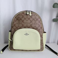 New Coach Court Backpack In Signature Canvas Khaki/ Pale Lime 5671 $450 Signature Coated Canvas And Refined Pebble Leather Inside Zip And Multifunction Pockets Double Zip Closure, Fabric Lining Handle With 2 1/4" Drop Outside Zip Pocket Adjustable Shoulder Straps 10 3/4" (L) X 12 1/2" (H) X 4 3/4" (W) Style No. 5671 Coach Fannypack, Slim Backpack, Packable Backpack, Big Handbags, Monogram Backpack, Daypack Backpack, Day Backpacks, Flap Backpack, Black Leather Backpack