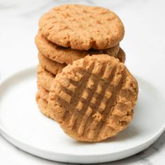 three peanut butter cookies stacked on top of each other