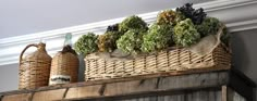 some baskets are sitting on top of a shelf