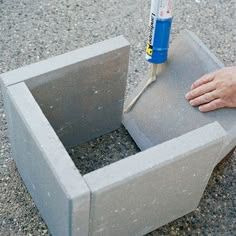 an image of someone using concrete to build a planter