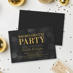 two black and gold bachelor party cards with confetti on the table next to them