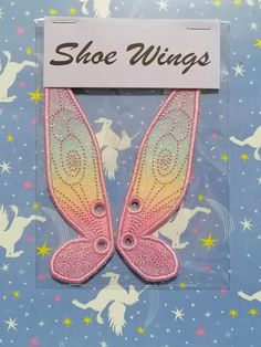 Glam up your shoes with these colourful wings! Each wing measures 5 x 1.25 inches and is made on a industrial embroidery machine.  Choose your colour from the list below, please be aware colours can differ slightly from the photos but I am happy to send more photos to you on request. You can also choose your thread colour too, just enter the colour into the box and I'll send you photos with threads of that colour for you to choose from. These can be used on any shoes with laces such as trainers, Doctor Martens, Converse and even roller skates. These are made to order and will be posted to you within 7 working days of ordering. Winged Shoes, Shoe Wings, Doctor Martens, Industrial Embroidery, Shoes With Laces, Wings Fairy, Quad Skates, Embroidery Shoes, Wing Shoes