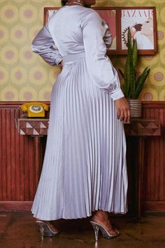 Effortless plus size women's pleated maxi dress in fit to flare design, v neck style, waist belt and long sleeves with buttoned wrist cuffs.(100% POLYESTER) NO STRETCH Model Info: Height: 5'10" Bust: 42" Waist: 37" Hip: 54" 1XL Split Maxi Dress, Pleated Maxi Dress, Pleated Maxi, Satin Mini Dress, Wrist Cuffs, Silver Dress, Long Sleeve Midi, Long Sleeve Midi Dress, Waist Belt