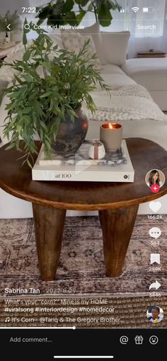 a coffee table with a potted plant on top