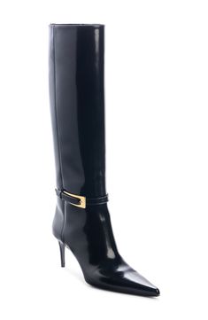 Crafted from polished calfskin leather, this knee-high boot is designed with a slim, buckled belt wrapping the ankle and a sharply chiseled pointy toe. 2 3/4" (70mm) heel 17" shaft, 14" calf (size 38 1/2) Adjustable strap with buckle closure Leather upper, lining and sole Made in Italy Designer Shoes Fitted Calf Leather Boots With Buckle Closure, Luxury Office Boots With Buckle Closure, Luxury Patent Leather Knee-high Boots For Formal Occasions, Luxury Calf Leather Knee-high Boots For Formal Occasions, Luxury Calf Leather Knee-high Boots For Formal Wear, Luxury Boots With Buckle For Work, Luxury Boots With Buckle Closure For Work, Luxury Workwear Boots With Buckle Closure, Elegant Fitted Knee-high Boots With Buckle Closure