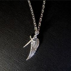 Buy any 2 Jewelry Items and get a 3rd item at equal or lesser value FREE !                                                                                                                                                                                                                                Lovely Silver Wing and Sword Supernatural Inspired Castiel Necklace. Inspired by the T.V. show supernatural. They include Castiel's Angel wings and his  Blade. Perfect gift for any Supernatural fan. Com Castiel Necklace, Angel Wing Necklace, Necklaces Silver, Supernatural Fans, Silver Wings, Charm Necklace Silver, Wing Necklace, Necklace Choker, Bethlehem