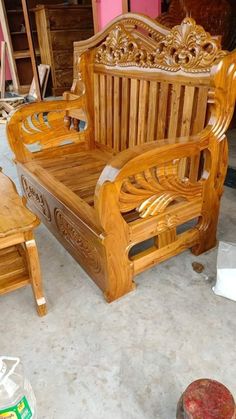 a wooden bench and chair sitting on the floor in a room with other wood furniture