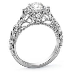 a white gold engagement ring with an intricate design