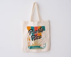 a tote bag with the words puerto rivo on it hanging from a wall