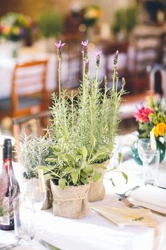 the table is set with flowers and wine