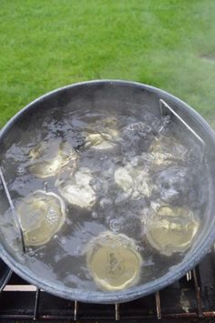 some food is cooking on an outdoor grill