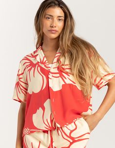 Duvin Trouble In Paradise Crop Button Up Shirt. Relaxed Cropped Cabana Button Up Shirt Featuring An Allover Hibiscus Print. Button Front. Breast Pocket. Camp Collar. Short Sleeve. Straight Hem. Cropped And Boxy Fit. 58% Rayon, 42% Polyester. Machine Wash. Imported. Model Is Wearing A Size Small. Model Measurements:height: 5'7" Bust: 34.5"waist: 27"hips: 38" Red Hawaiian Button-up Shirt For Vacation, Vacation Tops With Buttons And Camp Collar, Hawaiian Shirt With Button Closure For Beach, Beach Hawaiian Shirt With Button Closure, Hawaiian Vacation Tops With Button Closure, Vacation Hawaiian Shirt With Button-up Closure, Hawaiian Button-up Shirt For Vacation, Hawaiian Vacation Tops With Buttons, Hawaiian Button-up Top For Vacation