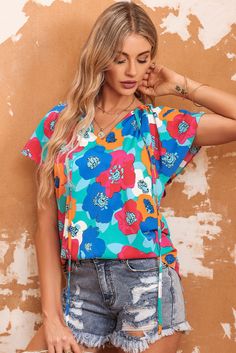 This women's blouse features an airy, relaxed fit. Elongated flutter sleeves create a striking aesthetic, while the vibrant florals provide a hint of femininity. The drawstring v-neck adds a touch of sensual charm. Category: Tops > Blouses & Shirts Material: 100%Polyester Sleeve Length: short sleeve Neckline: V Neck Occasion: Daily Brand: None Style: casual Color: Multicolor Silhouette: Shift Pattern: Floral Size Chart (CM): Sizes Bust Sleeve_Length Length Hem_Width Relax Relax Relax Relax S 98 Lisa Fischer, Shift Pattern, Floral Pants, Printed Drawstring, Flutter Sleeves, Neck Pattern, Sleeve Designs, Online Boutiques, Short Sleeve Blouse