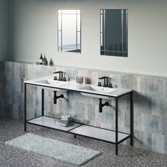 a bathroom with two sinks and mirrors on the wall next to a rug in front of it