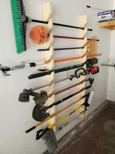 there are many different types of tools hanging on the wall