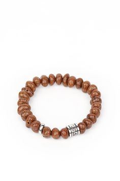 Featuring a natural finish, a collection of faux brown stones are threaded along a stretchy band around the wrist. Shimmery silver accents are added to the earthy compilation for an artisan inspired finish. Sold as one individual bracelet. 11/17/21 Brown Bracelet, Silver Frames, Unisex Bracelets, Band Bracelet, Paparazzi Accessories, Stretchy Bracelets, White Rhinestone, Chic Jewelry, Paparazzi Jewelry