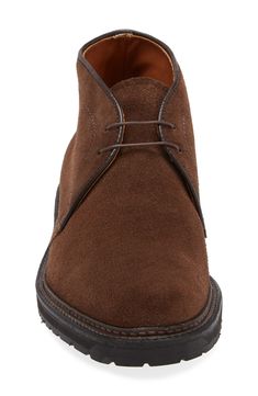 Handcrafted in New England of richly grained suede, this chukka boot boasting a tempered steel shank beneath the foot arch brings comfort to each step. Lace-up style Cushioned insole Leather upper and lining/rubber sole Made in the USA Designer Shoes Suede Work Boots With Reinforced Heel And Plain Toe, Formal Suede Lace-up Boots With Reinforced Heel, Suede Lace-up Boots With Goodyear Welt Construction, Suede Boots With Lug Sole And Moc Toe, Classic Suede Chukka Boots With Reinforced Heel, Suede Goodyear Welted Lace-up Chukka Boots, Suede Lace-up Chukka Boots With Goodyear Welted Construction, Goodyear Welted Suede Chukka Boots, Suede Work Boots With Goodyear Welted Round Toe