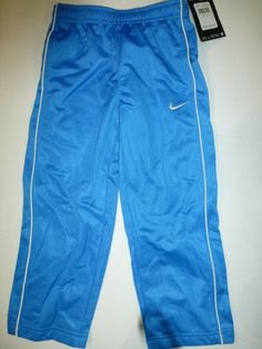 new with tag smoke free nike toddler boys athletic pants photo blue 4T 2 front pockets polyester elastic waist white nike swoosh on left leg 762140-419 retailed for $30 Light Blue Cotton Sports Bottoms, Light Blue Cotton Sport Bottoms, Sporty Blue Cotton Pants, Light Blue Sporty Cotton Pants, Sporty Light Blue Cotton Pants, Light Blue Cotton Sporty Pants, Spring Blue Athletic Pants, Nike Blue Sweatpants With Pockets, Blue Nike Cotton Bottoms